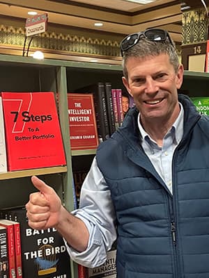 Edward Goodfellow in front of book case at Munro's books